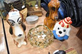 Three mid century dog figures and an art glass dish