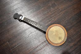 A folk art style banjo/ukulele.