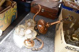 An art deco three branch copper light shade having lily style shades