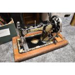 A 1920's English JONES FAMILY C.S. Type 7 Queen Alexandra Sewing Machine with wooden case