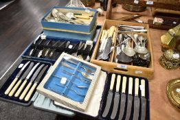 A selection of cutlery table and flat wares including cased fruit knives