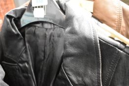 A black leather trench coat and similar trousers