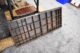 An antique printers block tray or rack