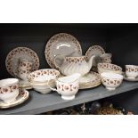 A part tea service by Royal Imperial having a gilt and burgundy glaze