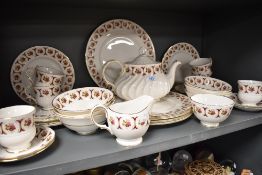 A part tea service by Royal Imperial having a gilt and burgundy glaze