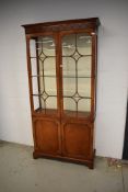 A nice quality reproduction bookcase/display cabinet with cupboard under (some glass damaged hence