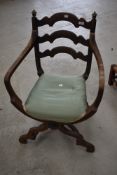 An oak frame Savanarola stile ladder back boudoir chair