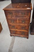 A reproduction Regency style occasional chest of two over three drawers, width approx. 48cm,
