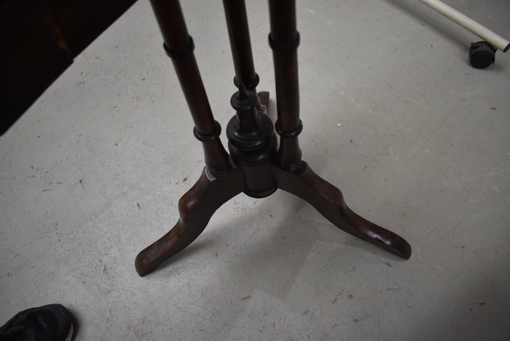 A Victorian mahogany folding occasional table, having triple column support on splay legs, in need - Image 2 of 3