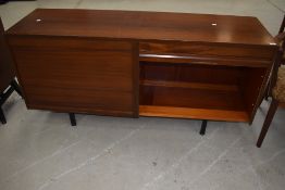 A vintage sapele sideboard (office or living) having tambour doors, width approx 153cm