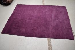 A modern purple rug, approx. 180 x 126cm