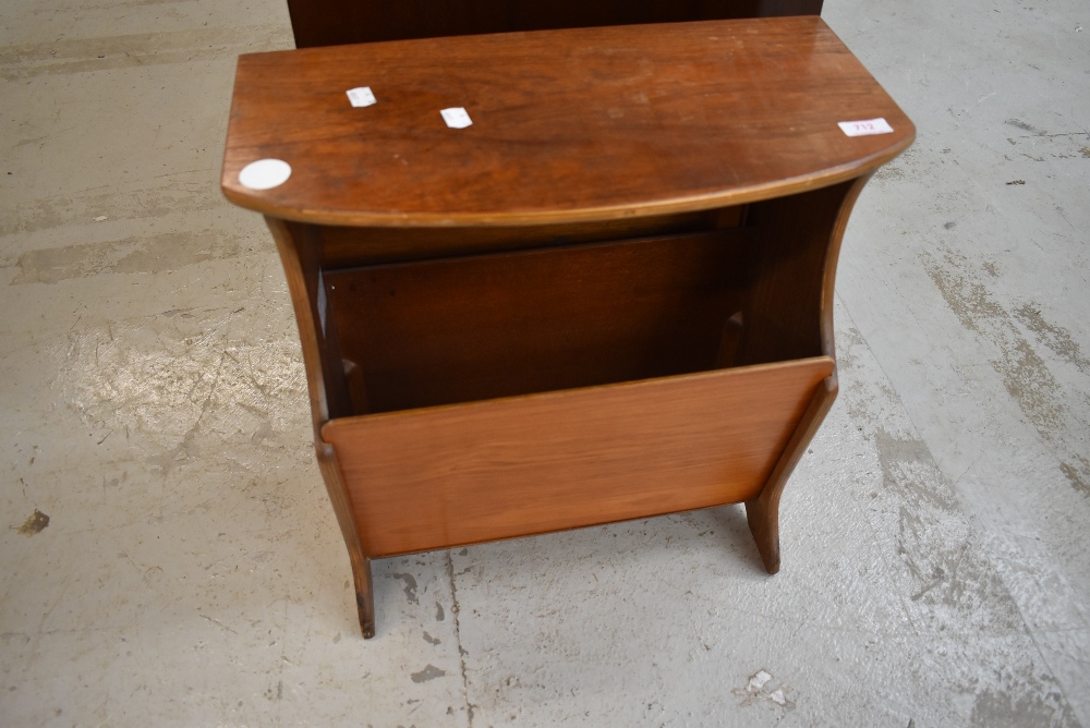 A vintage stained ply magazine table