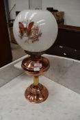 A traditional copper and brass oil lamp with clear chimney and opaque shade. Height approx 55cm (