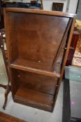 A vintage oak and ply bookcase (not stacking) with glass sliding doors, height approx. 144cm,
