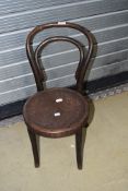 A traditional bentwood childs chair