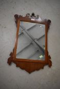 A Chippendale style wall mirror having silver back