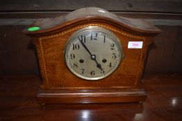 A mahogany cased mantle clock having inlayed banding and chime