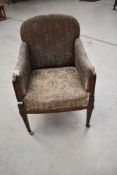 An Edwardian mahogany and inlaid upholstered armchair, good for a restoration project