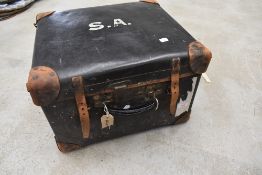 A vintage part leather luggage trunk, labelled Best, dimensions approx. 50 x 44 x 33cm