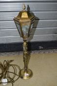 An early 20th Century brass table lamp having streetlight style top on totem column , height approx.