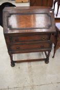 An early 20th Century oak bureau , on twist frame, width approx. 76cm