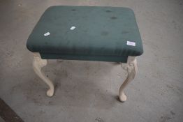 a modern reproduction piano or similar stool having carved legs