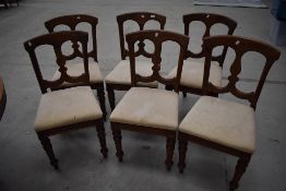 A set of six mahogany framed Victorian dining chairs by J Reilly having vase back design