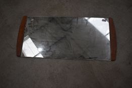 A vintage teak edged wall mirror, width approx. 79cm