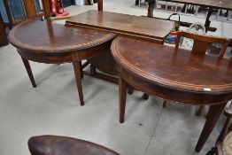 A pair of 19th Century mahogany and inlaid demi lune hall tables, front legs only, been secured to