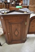 A 19th Century oak corner cupboard