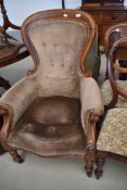 A Victorian stained frame scroll armchair having part button back, with later dralon upholstery