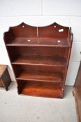 A dark stained pine wall shelf, width approx. 55cm