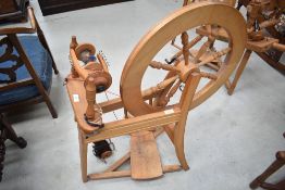 A traditional spinning wheel, labelled Ashford