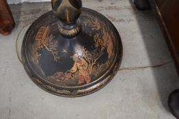 A late 19th or early 20th Century ebonised and chinoiserie detailed standard lamp