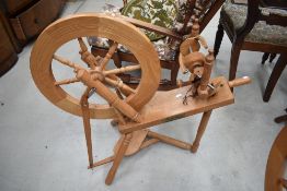 A traditional spinning wheel, possibly Ash