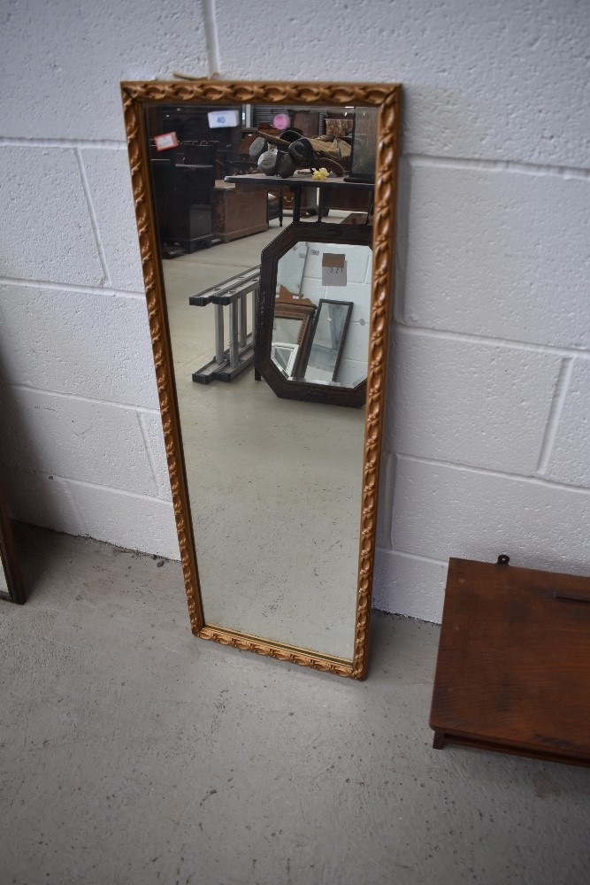 A gilt frame narrow wall mirror