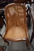 A Continental style easy chair having bergere seat and back