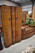 A mid 20th Century walnut ply wardrobe and dressing table