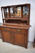 A late 19th Century oak mirror back sideboard, some damage to plinth, width approx. 138cm