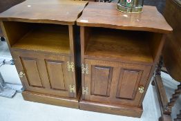 A pair of vintage/modern stained frame bedside cabinets of large proportions