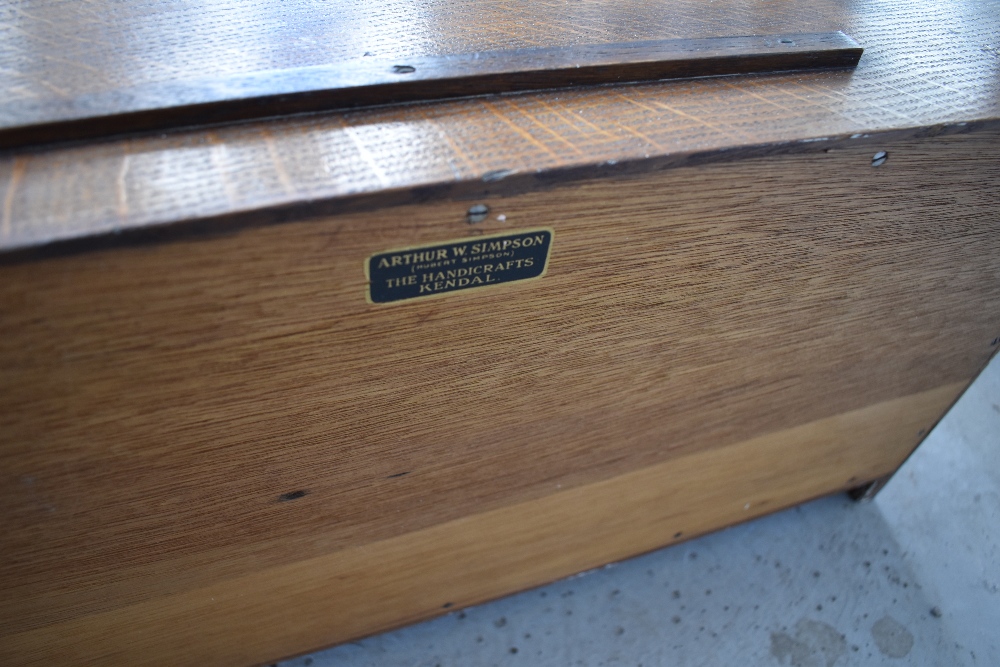 An Arts and Crafts golden oak wall shelf, labelled for Arthur Simpson Handicrafts - Image 2 of 4