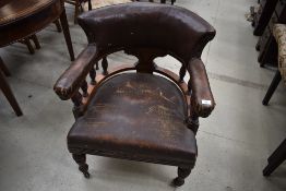 A Victorian mahogany turned frame tub chair