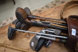 A selection of vintage golf clubs in early bag, includes William Perrins