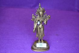 A bronze cast figure of a Tibetan Buddhist Goddess Tara standing 17cm approx
