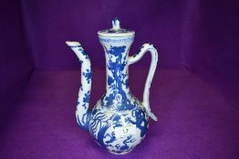 A modern Chinese rice wine or similar ewer having dragon decoration with seal mark to base