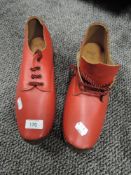 A pair of vintage red clogs, from clog sole mill Hebden bridge.