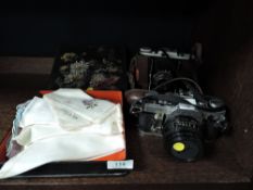 Two vintage cameras including Canon AE-1 and a selection of handkechiefs