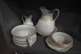 An Ashworth wash jug a bowl vanity set in gilt and white ground