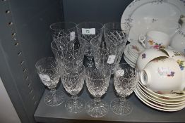 A selection of clear cut crystal glass wares including four Thomas Webb sherry glasses