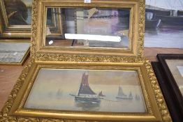 A painting of boats at sea by Fitzgerald with two matching gilt and gesso frames